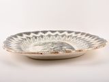 a white bowl with a black and white design on it