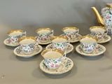 a lot of cups and saucers that are on the table