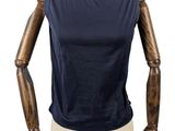 the mannequin is wearing a blue top with a wooden arm