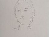 un dessin du visage d'une femme sur un morceau de papier