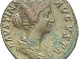 a close up of a coin with a woman ' s face on it