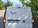 a white van that is parked on the side of the road