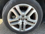 the tire of a car with a flat tire is shown