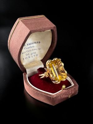 a ring that is in a box on a table
