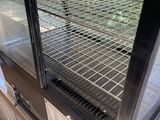 an image of a grill with a grilling rack inside of it
