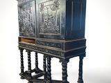 a black cabinet that is sitting on top of a table