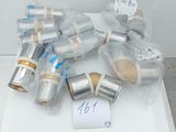 a lot of silver and gold items on a white table