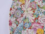 a plate with a floral design on it on a table