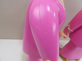 a pink toy that is next to a pink toy