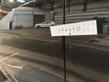 a sticker on the door of a car that is parked in a garage