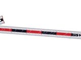 a close up of a ruler on a white background with a red stripe