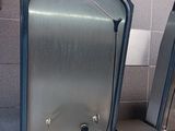 two sinks in a public restroom with a sink in front of them