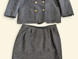 a picture of a woman ' s skirt suit and jacket