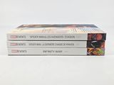three books are stacked on top of each other on a white surface