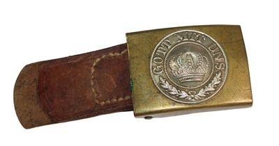 belt buckle with a crown on it on a white background