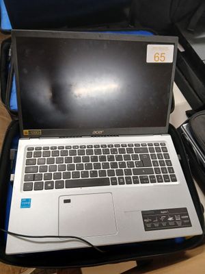 a laptop that is sitting in a suitcase on the floor