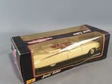 an open box of a toy car sitting on top of a table