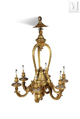 a gold colored chandelier with five lights hanging from it