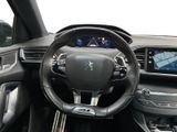 the interior of a car with a steering wheel and dashboard controls