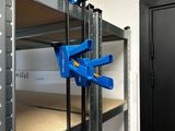 two clamps that are on a shelf in a room