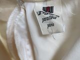 a close up of a white shirt with a label on it