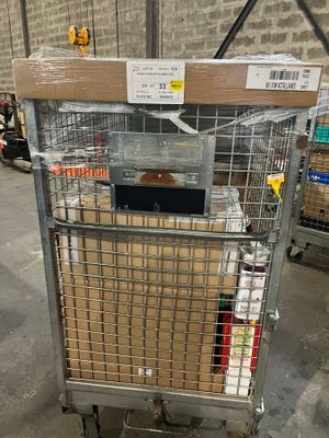 a metal cart with boxes in it in a warehouse
