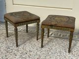 two small stools sitting next to each other on a tiled floor