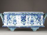 an image of a blue and white planter with a design on it