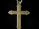 a gold cross on a black background