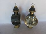 pair of antique brass and black lanterns on a white background