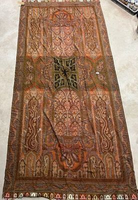 an image of a rug on the floor next to a guitar