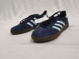 blue adidas sneakers with brown soles on a white background