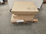 a stack of boxes sitting on a pallet in a warehouse