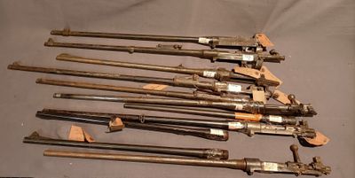a lot of old weapons that are on a table