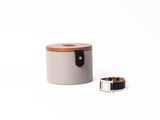 an image of a small wooden box with a ring on top of it