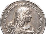 a close up of a silver coin with a woman on it