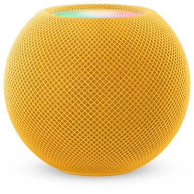 une enceinte HomePod de couleur pomme jaune posée sur une surface blanche