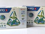 two boxes of geomag are shown on a white surface