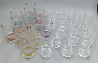 a lot of glasses that are sitting on a table
