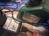 an image of a drill and a power cord on a table