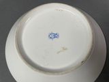 a white plate with a blue design on it