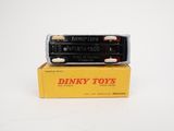 two dinky toys are stacked on top of each other on a white surface