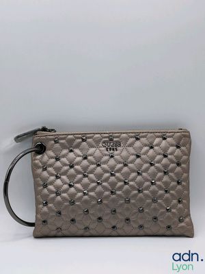 a small grey purse with studded details on the front