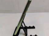 a cell phone that is sitting on a stand