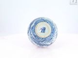 a blue and white ball with a picture of a man on it