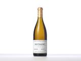 a bottle of white wine sitting on top of a table