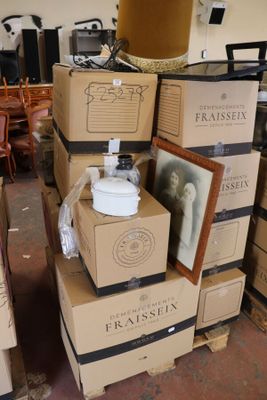 boxes stacked on top of each other in a room filled with furniture