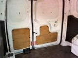 a white van with a bed in the back of it