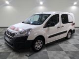 the white van is parked on a checkered floor in a room