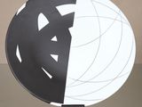 a black and white plate with a white and black design on it
